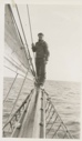 Image of Man standing on boom of the Thebaud